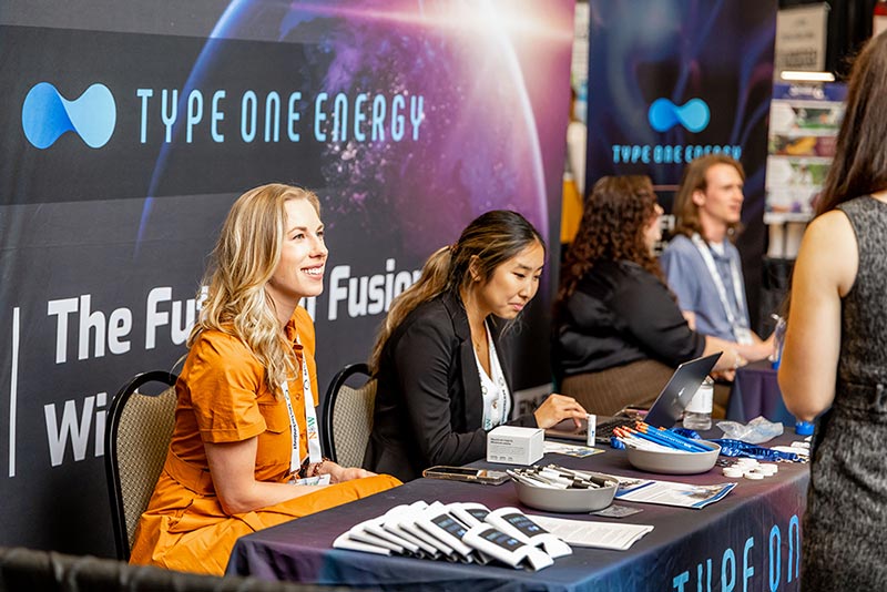 type one energy employees at trade show photo